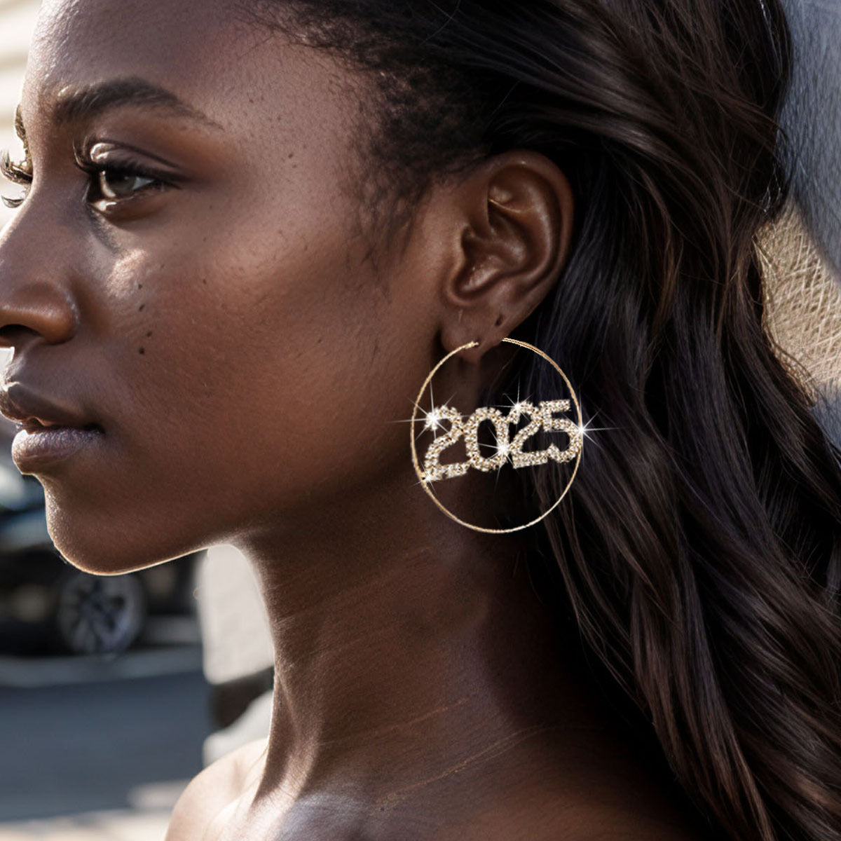A girl with a great design earring in the shape of 2025
